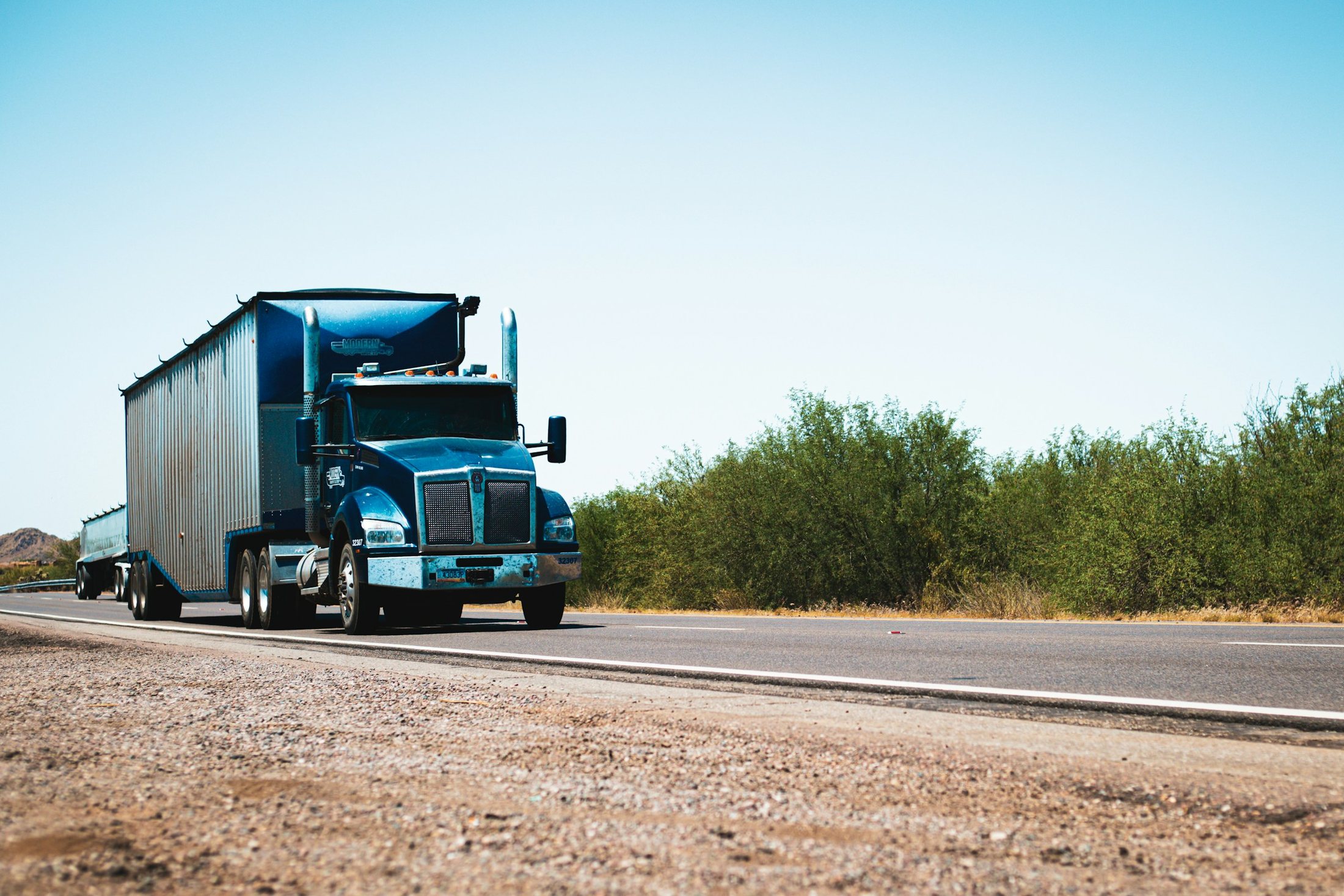 Semi truck traveling through the Arizona desert