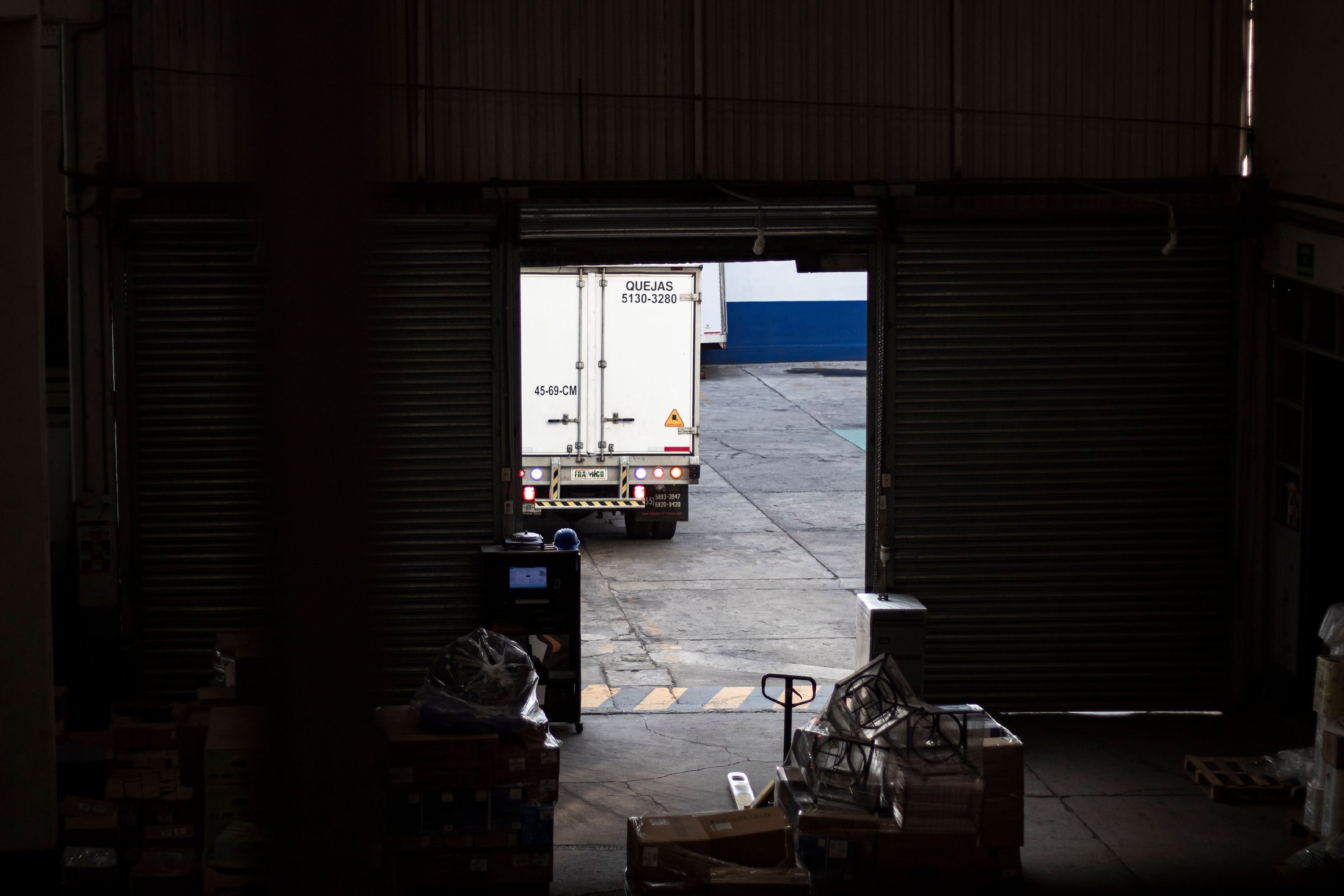 Truck leaving a warehouse loading dock